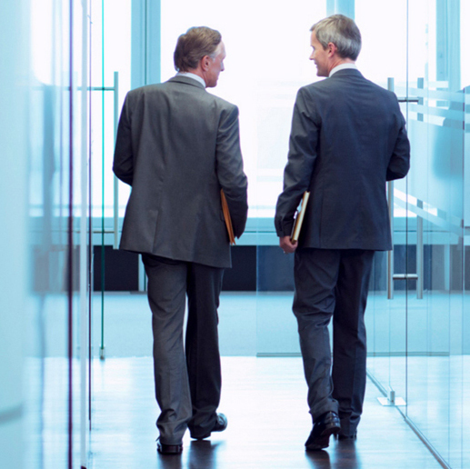 Businessmen walking and talking